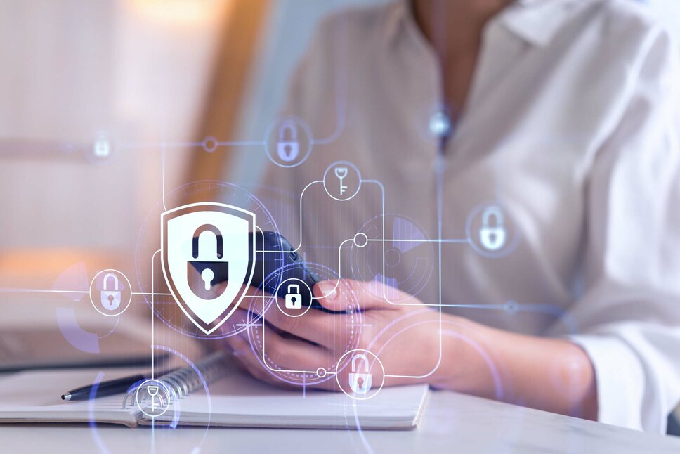 Business Ethics and Compliance - Data Protection A woman holds a smartphone in her hand, with various security symbols overlaid on the photo, emphasizing the focus on safety and technology. In the business ethics of weba Werkzeugbau, this image symbolizes data protection and the handling of information.