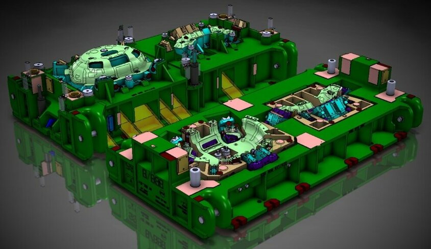 Bildschirmaufnahme einer CAD-Konstruktion eines großen Stufenwerkzeuges für die Kaltumformung, dargestellt auf einem dunkelgrauen Hintergrund. Die Aufnahme zeigt die detaillierte und präzise Ausarbeitung des Werkzeuges mit all seinen Komponenten und Mechanismen. Die verschiedenen Ebenen und Teile des Werkzeuges sind klar erkennbar und heben sich deutlich vom dunkelgrauen Hintergrund ab, was die technische Komplexität und das handwerkliche Können, das in die Konstruktion eingeflossen ist, unterstreicht.