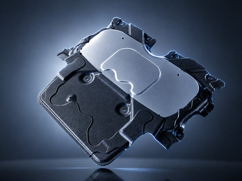 This part is an underbody protection component for vehicles, developed and manufactured in pre-series production at weba Germany. The combination of a lightweight, durable plastic base body with a reinforcing metal plate ensures optimal protection and stability. Precise processing and innovative design provide high resistance to external influences, which is essential for use in the automotive industry.